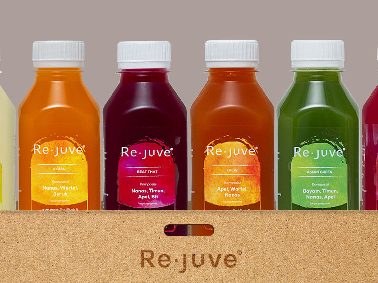 A group of Re.juve bottles inside a carboard carton.